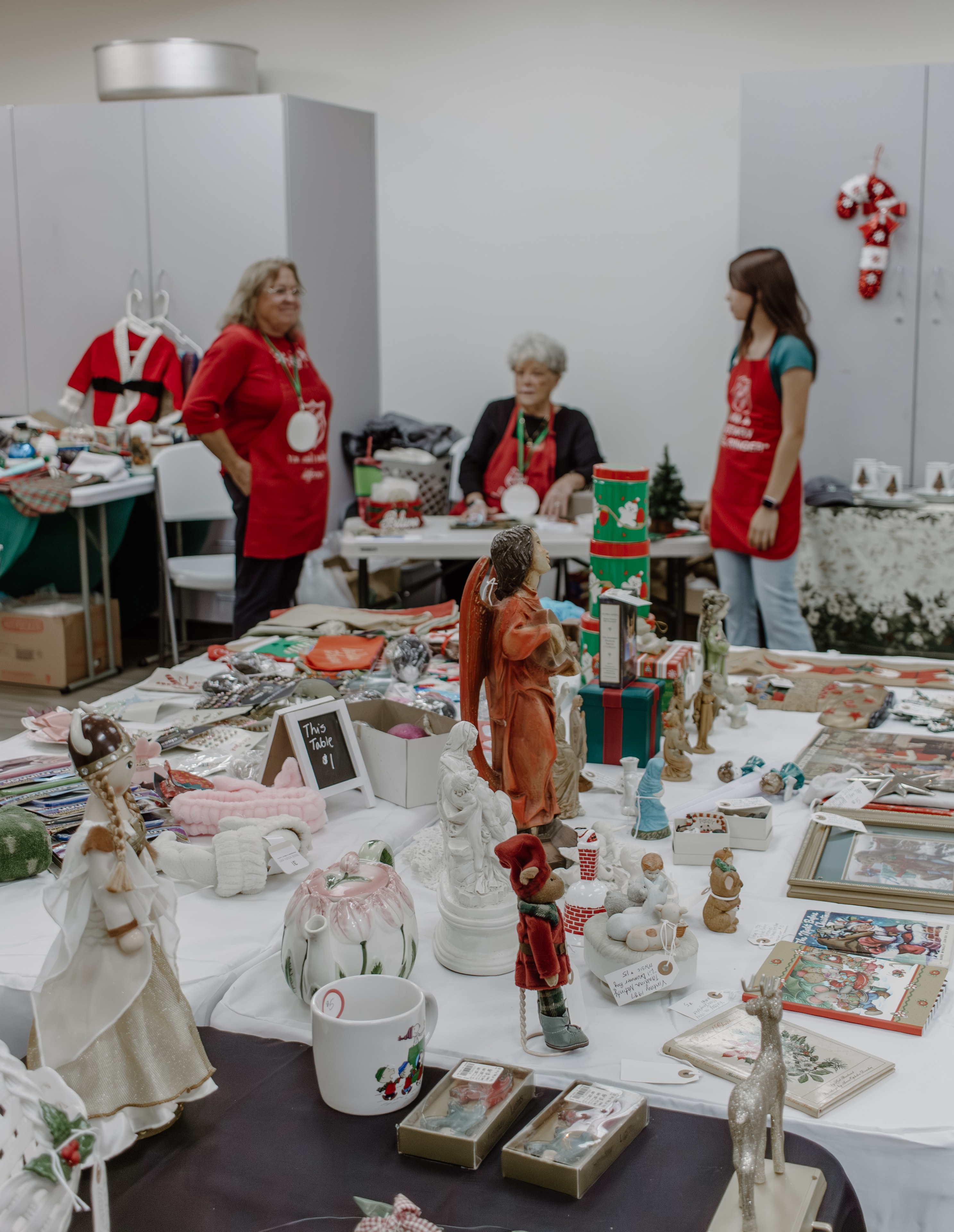 Three decorated Christmas trees at the Naples Festival of Trees 2025
